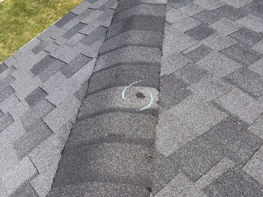 Marked hail strike on a roof in Ohio. Chalk marked during a storm damage roof inspection.