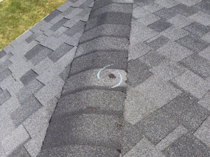 Marked hail strike on a roof in Ohio. Chalk marked during a storm damage roof inspection.