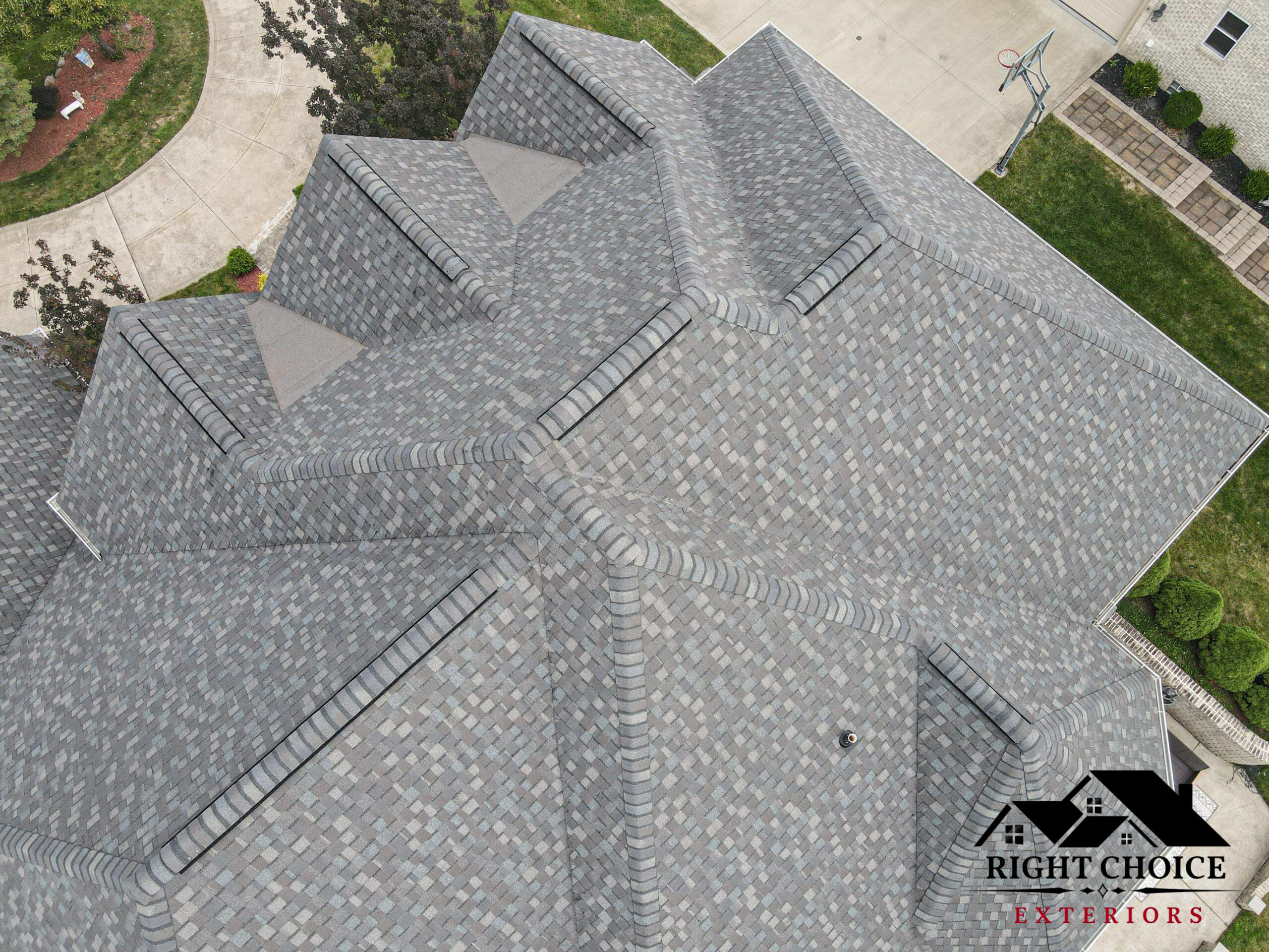 Roofing crew installing new shingles on an Ohio home