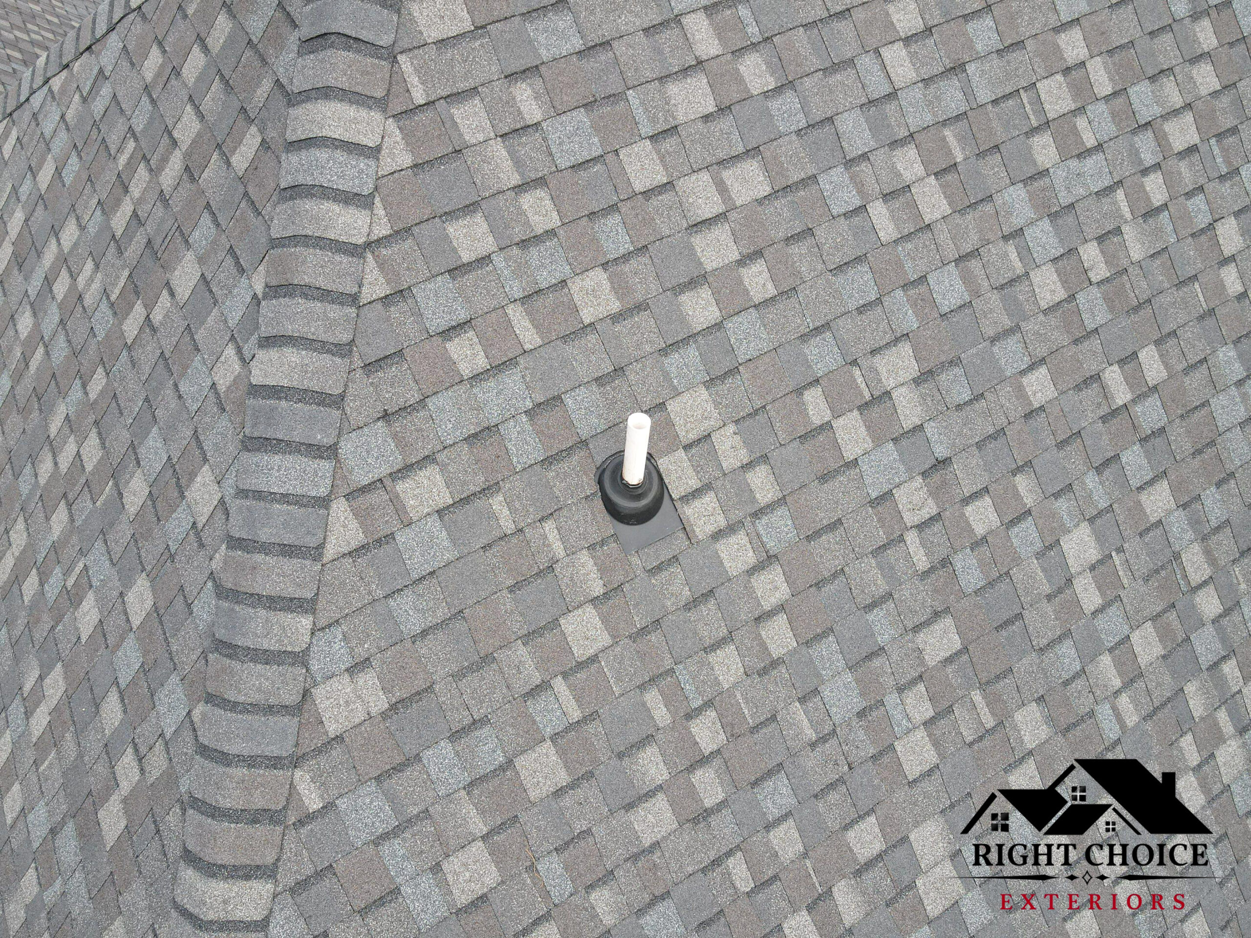 Crew installing a new asphalt shingle roof on an Ohio home